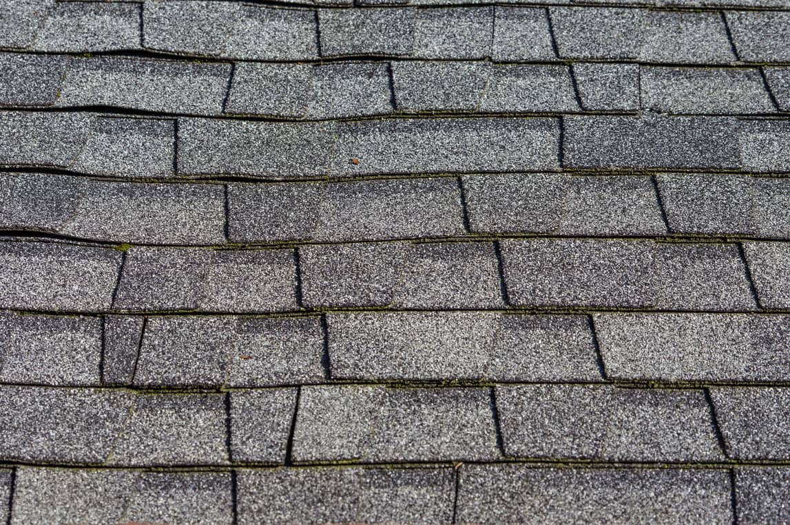 Composition shingled roof with definition.