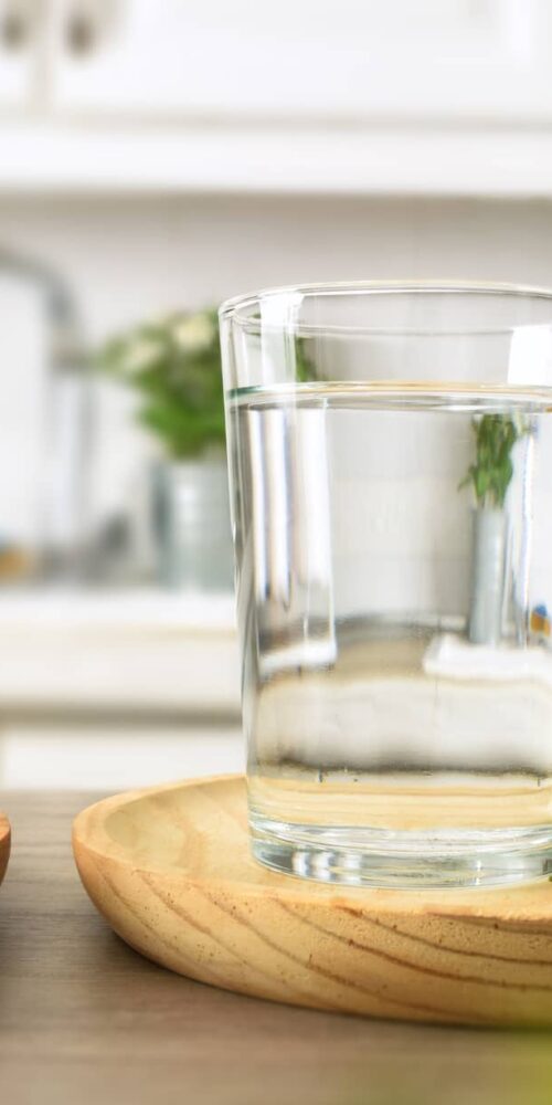 Cloudy tap water in a glass.